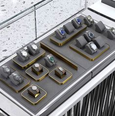 a display case filled with lots of different types of watch faces and bracelets on top of each other