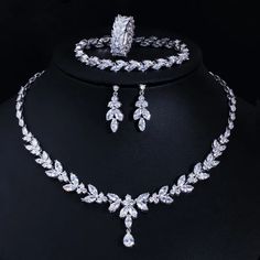 Complete your wedding look with this elegant Bridal Necklace and Earring Jewelry Set. The set is designed to add a touch of sophistication and style to your bridal ensemble, making you shine on your special day.
– This bridal a plus cubic zirconia gemstone necklace set is perfect for adding elegance to any bridal ensemble.– Made with high-quality materials, this set includes a stunning necklace and matching earrings for a complete look.– Perfect for pageant, bridal, bridesmaid, prom, quinceañer Ring And Bracelet, Wedding Necklace Set, Zircon Necklace, Bridal Necklace Set, Bracelet Wedding, Cubic Zirconia Necklace, Fashion Jewelry Sets, Wedding Bridal Jewellery, Leaf Jewelry