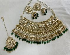 "Tyaani inspired Green and Gold Indian / Pakistani Jewellery Set - Choker Necklace and Earrings. Sabyasachi inspired. PACHI KUNDAN (gold plated) We have a large inventory - message us what shade you are looking for or send picture of your outfit to match. Fast shipping - Canada & USA \"Life is better ... with a Touch of Elegance\". Message for any questions." Gold Gota Work Sets For Wedding, Gold Gota Work Wedding Sets, Gold Bridal Necklace With Gota Work For Celebration, Green Kundan Necklace With Gota Work For Celebration, Elegant Green Zari Work Kundan Necklace, Green Traditional Wear With Stone Work For Diwali, Elegant Green Meenakari Lehenga, Elegant Green Lehenga With Meenakari, Green Wedding Sets With Tilla Embroidery