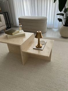 a coffee table with a lamp on it in a living room