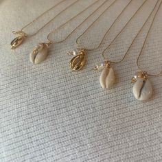 "Gold plated 17\" necklace. The chain is adjustable. Very versatile and great for layering." Pika Shell Necklace, Single Shell Necklace, Shell Necklace Aesthetic, Shell Jewelry Ideas, Cowrie Shell Jewelry, Fresh Water Pearl Necklace, Surf Jewelry, Water Pearl Necklace, Cowrie Shell Necklace