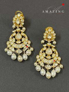 Silver Moissanite Polki Earring, Kundan Chandelier Bridal Jewelery, Traditional Jewelery 925 Silver Earring,18K Plated, Wedding Jewelery Statement Earring Drop Pearl Earring Material : Silver Gemstone: Moissanite, Drop Pearl Stone colour: Uncut Polki Primary colour: Gold Size-Length60mm Width:30mm Closure : Screw back and Clips Silver Intricate, hand crafted, Pure Silver Polki Earrings, studded with high quality Moissanite Polki comes with screw back and clips, made in 92.5 silver with 22ct gold Luxury Chandbali Bridal Earrings For Festive Occasions, Luxury Rose Cut Diamond Chandelier Earrings For Wedding, Luxury Kundan Earrings With Intricate Design, Diamond Chandelier Earrings In Yellow Gold For Wedding, Yellow Gold Diamond Chandelier Earrings For Wedding, Luxury Festive Chandbali Bridal Earrings, Luxury Chandbali Earrings For Festivals, Wedding Chandelier Earrings In Yellow Gold With Diamonds, Wedding Yellow Gold Diamond Chandelier Earrings