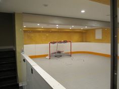 an empty ice rink in the middle of a building