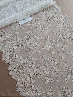 Quantity available. Please "Add to cart" to see available quantity. Ivory soft lace trimming. This lace is also available in black color. Please ask about black color. Both sides scalloped. Width: 50 cm/19.7 inches Item number: WDL6012 Made in Europe www.LaceToLove.com Price is set for one meter/yard.  You will receive the fabric in one continuous piece if you purchase more than 1 meter/yard. IMPORTANT! Maximum one piece length of this lace trimming is 3 meters/yards. If you buy more than 3 mete Elegant Scalloped Lace For Brides, White Scalloped Lace Dress For Wedding Night, Scalloped Lace Wedding Dress, White Lace Wedding Dress With Lace Back, White Lace Back Dress For Wedding, Lace Wedding Dress With Lace Trim For Bride, Wedding Night Lace Dress With Lace Back, Ceremony Veil With Lace Trim, Ceremony Lace Veil With Lace Trim