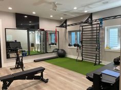 a home gym with exercise equipment and mirrors