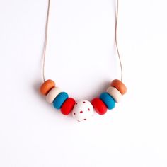 Red Dots - Handmade Clay Necklaces - Mixed Colors - Wearable Art - Jewelry - Unique Design - With Leather Cord Red Artisan Beaded Necklaces For Crafting, Artisan Red Beaded Necklaces For Crafting, Handmade Orange Necklace For Everyday, Handmade Artsy Red Jewelry, Artsy Handmade Red Jewelry, Handmade Red Craft Supplies, Handmade Red Artsy Necklaces, Handmade Red Artsy Necklace, Handmade Red Necklace For Everyday