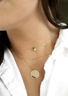 "𝗘𝗮𝘀𝘆 𝗧𝗼 𝗦𝘁𝘆𝗹𝗲, 𝗠𝗮𝗱𝗲 𝗧𝗼 𝗟𝗮𝘀𝘁 Our bold 3/4\" necklaces are easy to layer, elegant, and ready to be personalized with your most special sentiments, moments, and memories! Created to last a lifetime, these necklaces will remain evergreen even as the years and trends come and go. 𝗠𝗮𝘁𝗲𝗿𝗶𝗮𝗹𝘀 𝗪𝗲 𝗨𝘀𝗲 This necklace is made entirely with sturdy 14k yellow gold filled, 14k rose gold filled, or sterling silver pieces. It is safe to wear in the shower, but we recommend avoi Everyday 14k Gold Filled Coin Pendant Jewelry, Gold Charm Necklace For Everyday - May Birthstone, Gold Plated Birthstone Necklace With Round Pendant, 14k Gold Filled Necklace For May Birthstone, Everyday Gold Plated Round Disc Jewelry, May Birthstone Jewelry Medallion Gift, Gold Jewelry For May Birthstone, Round Shape, 14k Gold-filled Round Birthstone Necklaces, 14k Gold Filled Round Birthstone Necklaces