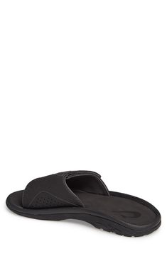 Supple faux leather defines an easygoing slide sandal featuring an adjustable strap for a superior fit. Style Name:Olukai Nalu Slide Sandal (Men). Style Number: 5298163. Black Slip-on Slippers With Arch Support, Black Leather Beach Slides, Black Open Toe Slippers With Leather Footbed, Black Leather Slides For Beach, Black Leather Slides For The Beach, Black Casual Slippers With Single Toe Strap, Black Single Toe Strap Slippers For Vacation, Black Leather Footbed Slippers For The Beach, Black Vacation Slippers With Single Toe Strap