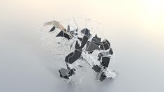 an animal made out of broken glass on a white surface with no one around it