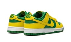 The Nike Dunk Low “Reverse Brazil” is a two-tone, yellow-and-green colorway of the retro basketball shoe that flips the color scheme of the model’s popular “Brazil” style.  As its name suggests, the “Reverse Brazil” reverses the color coordination of the “Brazil” Dunk, and it doesn’t miss the mark.  The shoe features Yellow Strike leather overlays and Swoosh branding on an Apple Green-colored leather base.  A green “Nike” logo is embroidered on the yellow leather heel tab.  Classic “Nike” detail Green And Yellow Shoes, Green And Yellow Sneakers, Reverse Brazil Dunks, Vintage Green Dunks, Green And Orange Dunks, Dunk Low Brazil, Yellow And Green Dunks, Nike Dunk Low Reverse Brazil, Nike Dunk Low Brazil