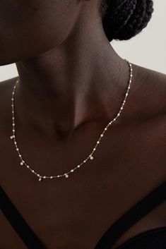 The white beads that decorate gigi CLOZEAU's necklace have been handcrafted by artisans in the south of France from resin that was chosen for its quality and shine. They're linked together by a dainty 18-karat gold chain and interspersed with dancing diamonds that glint prettily when they catch the light. Layer yours with other favorites. Luxury White Diamond Necklace With Pearl Chain, Fine Jewelry White Round Bead Necklaces, Fine Jewelry White Necklaces With Pearl Charm, White Pearl Diamond Necklace With Pearl Chain, White Diamond Necklace With Pearl Chain, Fine Jewelry White Pearl Drop Necklaces, Luxury White Polished Bead Necklaces, Luxury White Necklaces With Polished Beads, Luxury White Necklace With Polished Beads