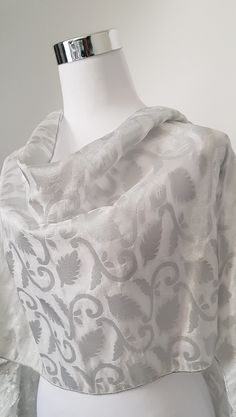 Silver Shawl with silver floral pattern on a light brocade type fabric. Elegant wrap, beautifully made with matching silver borders, very lightweight.  Keep it or gift it. Size is approx. Silver Shawl, Silver Scarf, Wedding Wraps, Beautifully Made, Silver Wedding, Scarf Wrap, Borders, Scarf Accessory, Shawl