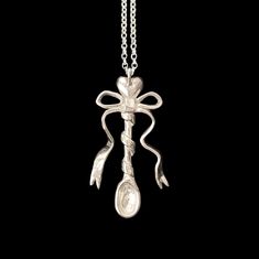 Hand carved spoon pendant wrapped by a bow on a 16"-19"/41cm-48.5cm chain. The pendant, the chain and all remaining components are made of solid sterling silver. This piece is made to order in my studio. Please allow up to 4 weeks for your piece to be shipped. Due to handmade nature, your piece may vary slightly from the picture. Website: www.haydenka.com Tags: spiky soldered soldering sharp coquette fairycore fairygrunge organic lost wax casting melted metal bow ribbon freshwater pearl apoc sto Lost Wax Pendant, Wax Carving Pendant, Melted Metal, Spoon Pendant, Hand Carved Spoon, Metal Bow, Carved Spoons, Melting Metal, Sterling Silver Spoons