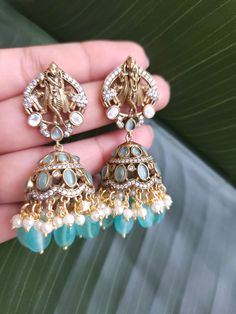 Fine Victorian Kundan Jhumka with CZ stones and uncut Polki Kundan stones Surely a statement Jhumka earringThe earring has very fine quality and craftmanship and also has a very elegant look pictures cannot do justice to how beautiful this jhumka earrings is . Length 2.5 inches Festive Peacock Design Earrings For Reception, Kundan Jhumkas For Reception, Chandbali Jhumkas For Reception, Blue Stone Work Temple Jewelry Earrings, Stone Work Drop Jhumkas For Reception, Stone Work Jhumkas For Reception, Heavy Kundan Jhumkas Drop Earrings, Kundan Earrings With Peacock Design For Navratri, Navratri Kundan Earrings With Peacock Design