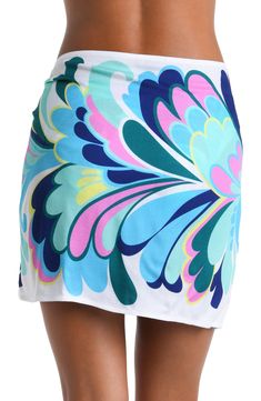 The print on this short pareo cover up features a bold and dynamic floral pattern with large, stylized petals in shades of blue, green, pink, and yellow, creating a modern and exuberant effect. The design has a flowing, organic quality to it, giving the impression of movement and radiance. The one-size-fits-all design provides a custom fit, and the side tie keeps everything undercover. [split] Details Short pareo cover up Adjustable wrap tie Tassel trim One size fits all Fabric 100% Rayon Crepe Beachy Blue Swim Skirt For Spring, Multicolor Summer Swim Skirt For Beach, Multicolor Swim Skirt For Summer Poolside, Multicolor Tropical Print Sarong For Poolside, Blue Swim Skirt For Spring Beach Cover-up, Multicolor Tropical Print Beachy Sarong, Beachy Multicolor Sarong With Tropical Print, Beachy Multicolor Printed Sarong, Beachy Multicolor Tropical Print Sarong