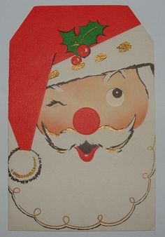 a christmas card with a santa claus's face and holly berries on his head