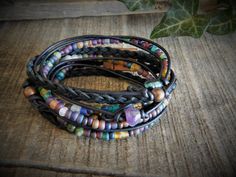 "This Wrap Bracelet for Women is so fun!, boho wrap brackets are so versatile, a bracelet you can wear every day. Amethyst Layering Bracelets are a great the summer look. ... Natural (will get darker with time) Napa leather braided, multi cord bracelet. A unique combination of High-fired stoneware, recycled glass, fresh water pearl and semi-precious stone beads combine to make this 3x wrap bracelet. It is adorned with a magnetic clasp that makes it very easy to put on by yourself. (4) SizesExtra Layering Bracelets, Boho Wrap Bracelet, Month Of June, Cord Bracelet, Wrap Bracelets, Amethyst Bracelet, Jute Bags, Fresh Water Pearl, Layered Bracelets