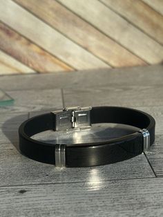 Make this New Retro Style Titanium Steel Men's Bracelet a token of your love, appreciation and friendship. Unique and eye-catching, this bracelet is a great gift for anniversaries, birthdays, and any other special occasion. Add extra meaning to your gift by personalizing it with engraving. Delight your friends, family or loved one with a custom touch that is sure to create lasting memories. Length: 8 1/2 in.  Width 0.5in. **No refunds for customized items unless the order was damaged in shipping or has an error. **We do not refund shipping charges or pay for return shipping. Black Engraved Bracelets For Everyday, Black Engraved Bracelets For Friendship, Classic Black Engraved Bracelets, Modern Black Bracelet As A Gift, Classic Leather Bracelet With Stainless Steel Clasp Gift, Minimalist Leather Bracelet With Stainless Steel Clasp, Black Engraved Leather Bracelet For Everyday, Modern Black Bracelets For Friendship, Black Stainless Steel Jewelry For Everyday Use