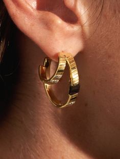 A layering of elaborate hoop earrings, the Dona Textured Onyx earrings are the creation you've been waiting for!

 Irresistibly chic, supremely elegant, they brilliantly swirl a mix of gold and silver, fine stones and high-quality gilding. Onyx Earrings, Brass Earrings, Gold And Silver, Ring Necklace, The Creation, Shop Earrings, Necklaces Bracelets, Swirl, Onyx