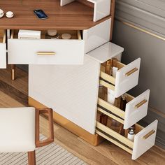 an office desk with drawers, phone and other items on it's side table