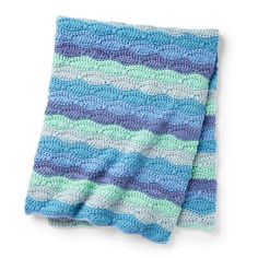 a crocheted dishcloth with blue and green stripes