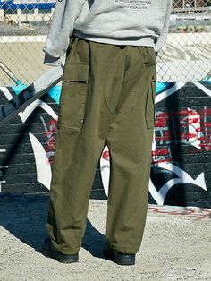 Editor's NotesFeaturing sizable cargo pockets and adjustable drawstring for natural fit and versatile silhouette, these pants are practical and stylish. They're made from lightweight and durable ripstop fabric that's used for work wear, street wear and outdoor wear.- Zip and button fastening- Two front slash pockets- Two side cargo pockets- Two back flap pockets- Adjustable drawstring at the hem- Wide fit- Unisex wearMeasurements (in.) M / L- Total Length: 39.8 in. / 40.6 in.- Waist: 16.1 in. / 16.9 in.- Hip: 24.4 in. / 25.6 in.- Hem: 8.3 in. / 9.1 in.Model info: - Man: 6' 1.6 / Fitting size L- Woman: 5' 8.9 / Fitting size MComposition & Care- 31% Cotton, 69% Polyester- Hand wash- Do not dry clean- Lay flat to dry in the shadeDesigner- by FLUKE Functional Baggy Outdoor Pants, Functional Baggy Pants For Outdoor, Hip Hop Style Pants For Outdoor Activities With Pockets, Combat Style Cargo Pants With Functional Pockets For Outdoor, Combat Cargo Pants With Functional Pockets For Outdoor, Outdoor Techwear Bottoms With Cargo Pockets, Techwear Pants With Pockets For Outdoor Activities, Outdoor Techwear Pants With Cargo Style, Khaki Parachute Pants With Side Pockets For Hiking