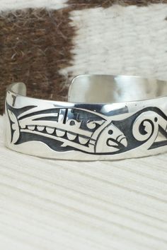 This sterling silver bracelet was made by Hopi silversmith Timothy Mowa. The inside is signed and stamped sterling.Size: 5 3/4" (will fit up to a 6 1/4" wrist)Gap: 3/4"Width: 3/4"Free shipping on all orders! We ship with USPS and always include tracking. All orders ship within a day of payment.Returns are accepted up to 30 days after you receive your order. Just send us a message. Our shop offers cash back or store credit. The item must be returned in new condition. Sterling Silver Bracelet, Native American Jewelry, Free Jewelry, Sterling Silver Bracelets, Cuff Bracelets, Silver Bracelet, Gap, Stamp, Bracelet