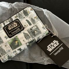 a star wars themed wallet sitting on top of a plastic bag