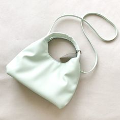 Mint Green Vegan Leather Soft Convertible Crossbody Hand Bag Brand New With Tags! Approx Measurements: 11.25 Inches (H) X 11.5 Inches (W) X 3.5 Inches (D) Elevate Your Everyday Style With This Soft Trapezoid Shoulder Bag From A New Day. This Shoulder Bag Is Designed With A Main Compartment With An Interior Zip Pocket And A Cellphone Pocket, And It's Secured By A Magnetic Closure. The Detachable Shoulder Strap Makes It Easy To Sling It Across Your Shoulder, And It Can Also Be Easily Removed To Gi Spring Crossbody Hobo Bag With Detachable Strap, Spring Crossbody Bag With Detachable Strap, Spring Satchel Hobo Bag With Detachable Strap, Spring Hobo Satchel Bag With Detachable Strap, Spring Crossbody Hobo Bag With Detachable Handle, Spring Crossbody Hobo Bag With Removable Pouch, Spring Satchel Hobo Bag With Top Carry Handle, Spring Hobo Bag With Removable Pouch In Crossbody Style, Spring Hobo Satchel Bag With Top Carry Handle