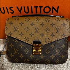 Beautiful Reverse Monogram Lv Pochette Mtis, Barely Worn, In Perfect Condition, No Scratches Or Stains, Serious Offers Only As Lv Does Not Go On Sale Like Other Luxury Brands Brown Monogram Canvas Bag In Light Luxury Style, Monogram Canvas Satchel Flap Bag With Gold-tone Hardware, Monogram Canvas Flap Bag With Gold-tone Hardware, Everyday Monogram Canvas Flap Bag With Gold-tone Hardware, Designer Brown Flap Bag For Daily Use, Flap Bag In Monogram Canvas With Branded Hardware, Flap Bags In Monogram Canvas With Branded Hardware, Brown Monogram Canvas Satchel With Flap, Monogram Canvas Bag With Branded Hardware And Flap Shape