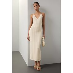 Off-white Knit (43% Recycled Polyester, 42% Viscose, 13% Polyester, 2%Polyamide). Casual dress. V-neck. Sleeveless. Pull on. 52" from shoulder to hemline. Imported. Elegant Ribbed Summer Dress, Beige Ribbed V-neck Midi Dress, Chic Ribbed Daywear Dress, Chic Ribbed Day Dress, Summer Evening Ribbed Midi Dress, Chic Ribbed Dress For Daywear, Chic Ribbed Maxi Dress For Summer, White Ribbed Daywear Dress, Elegant Ribbed Dress For Day Out