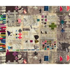 a patchwork quilt with many different designs on it