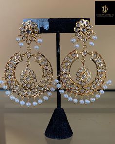 Ready to ship chandbali made using fresh water pearls , cz polki and 22carat gold plating length of earrings 3.2 inch width of earrings 1.8 inch Luxury Meenakari Pearl Earrings For Wedding, Luxury Cutdana Chandbali Earrings, Luxury Gold Dangle Chandbalis, Luxury Chinon Chandbali Saree, Luxury Chandbali Pearl Earrings With Intricate Design, Luxury Chandbali Jeweled Danglers, Luxury Gold Chandbalis For Festivals, Festive Gold Designer Danglers, Elegant Designer Chandbalis For Festivals