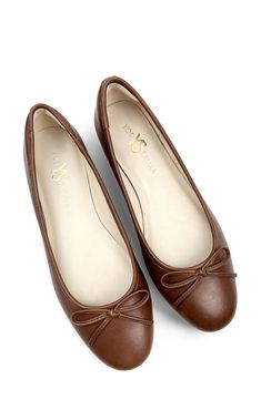 Signature logo hardware and a delicate vamp bow lend luxe elements to a timeless ballet flat set on a cushioned footbed for lasting comfort. Memory foam cushioning with arch support Slip-resistant sole Leather upper and lining/rubber sole Imported Elegant Brown Flats With Bow, Elegant Brown Ballet Flats With Removable Insole, Elegant Slip-on Ballet Flats With Arch Support, Elegant Brown Ballet Flats With Round Toe, Classic Brown Ballet Flats, Elegant Ballet Flats With Arch Support, Elegant Brown Round Toe Ballet Flats, Elegant Brown Ballet Flats Medium Width, Elegant Brown Medium Width Ballet Flats