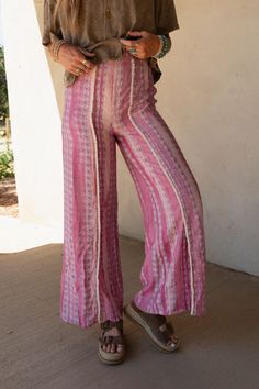 Effortlessly Cool and boho-chic you're never going to want to take the Walk The Line Wide Leg Pants off and they are the perfect addition to your wardrobe from this season to the next! Flowy, lightweight woven fabric with an eye-catching geometric striped print Relaxed and loose wide leg silhouette with a so CUTE trim center seam Flattering high-rise elastic waistband Unique mini bottom front slits for added style Pair with: Audra Waistband Loop Lace Bralette,Shirr Delight Puff Sleeve Top and Co Summer Vacation Boho Print Bottoms, Hippie Boho Print Vacation Bottoms, Festival Straight Pants With Elastic Waistband, Bohemian Boho Print Pants For Vacation, Boho Print Hippie Pants For Vacation, Hippie Boho Print Pants For Vacation, Vacation Hippie Pants With Boho Print, Vacation Boho Print Hippie Pants, Bohemian Ankle-length Wide Leg Pants For Vacation