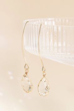 These glass teardrop hook earrings are the perfect addition to your bahcelorette going-out look. Shop our jewelry collection today. Make an entrance anywhere with these fun, dangly hook earrings with gorgeous glass teardrops. Wear them with your bridesmaid dress or with a chic-casual outfit for a bachelorette brunch. | Jewelry | Birdy Grey Chambers Glass Drop Earrings Elegant Glass Drop Jewelry, Elegant Drop Glass Jewelry, Elegant Drop-shaped Glass Jewelry, Elegant Glass Drop Earrings, Elegant Dangle Glass Jewelry, Elegant Glass Dangle Jewelry, Teardrop Crystal Earrings For Party, Delicate Dangle Crystal Party Earrings, Wire Wrapped Drop Jewelry For Party