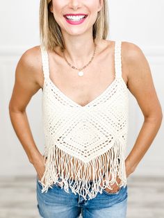 Be a boho babe with our Crochet Cropped Bustier Tank Top! This playful piece features delicate crochet and sassy fringe, perfect for any festival or beach day. Keep it cool and carefree with this quirky and stylish top. Fabric content: 100% Acrylic Bohemian Crochet Top For Beach Party, Bohemian Crochet Top With Tassels For Vacation, Summer Beach Tops With Tassel Ties, Beach Summer Tops With Tassel Ties, Bohemian Macrame Crochet Top, Bohemian Crochet Top With Crochet Trim For Summer, Summer Crochet Top With Fringe For Vacation, Bohemian Crochet Top With Trim For Summer, Crochet Lace Top For Festival Beachwear