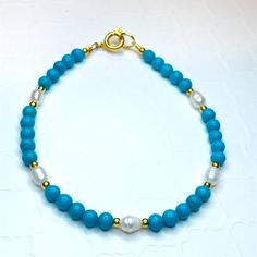 Pretty Simply Stated Piece Made With Magnesite, Fresh Water Pearls And 14k Gold Filled Beads. Made With A Gold Spring Ring Clasp. Elegant Single Strand Turquoise Bracelet, Blue Pearl Bracelet With Gemstone Beads For Gift, Blue Pearl Bracelet With Gemstone Beads As A Gift, Blue Single Strand Bracelet Jewelry, Bracelet Friendship, Fresh Water Pearls, Water Pearls, Bracelet Ideas, Jewelry Bracelet