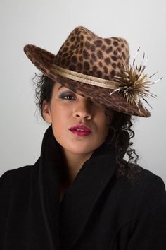 A truly stylish fedora style hat, hand blocked in a luxurious leopard print fur felt, finished with a gold braid hat band and distinctive goose biot trim. * Made to fit your head size- please choose the correct size from the drop down menu *This piece can be created in a variety of colours; please contact me to enquire  *Hand-made to order so please allow 3-4 weeks for dispatch. If you are working to a specific time frame however please contact me as I will always try to accommodate such request Stylish Winter Hats, How To Make Fascinators, Cheltenham Races, Trilby Fedora, Wedding Hat, Animal Print Fashion, Wedding Hats, Beautiful Hats, Hat Band