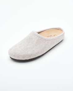 Description: The Nebraska Women's Wool Clog is an Italian take on a European classic. The women's Nebraska in beige is one of the most versatile mule style slippers available. From home to the office to weekend, the minimalist design of these clogs will take you anywhere in comfort. The anatomical self-molding latex and thermoforming cork insole provide firm customized comfort, and the insole is completely removable. LeClare Slippers are exclusively handcrafted in our small-batch factory in Trev Beige Slip-on Comfortable Slippers, Beige Closed Toe Slip-ons With Cushioned Footbed, Beige Cushioned Closed Toe Slip-ons, Classic Slip-on Mules With Textured Footbed, Cream Slip-on Slippers With Cushioned Footbed, Classic Slip-on Indoor Slippers, Cream Textured Slip-on Slippers, Comfortable Flat Clogs With Rubber Sole, Classic Slip-on Slippers With Textured Footbed