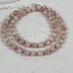 Pink Opal Round Beads Necklace For Gift, Pink Hand-strung Necklace As Gift, Pink Hand-strung Necklace For Gift, Pink Opal Single Strand Beaded Necklace As Gift, Single Strand Pink Opal Necklace With Round Beads, Pink Hand-strung Amethyst Jewelry, Elegant Pink Beaded Necklaces With 8mm Beads, Elegant Pink Beaded Necklace With 8mm Beads, Elegant Rose Quartz Round Beads Crystal Necklace