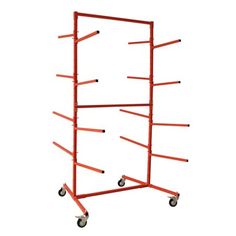 a red metal rack with wheels on it