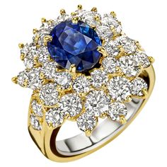 Magnificent 18 kt. Yellow Gold Ring With 2ct Sapphire and 2.8ct Diamonds , Estate His Majesty SUltan of Oman Qaboos Bin Said Sapphire: Intense Blue, Oval shape, Madagascar sapphire 2 ct. Comes with Carat Gem Lab Certificate CGL28028 Diamonds: Brilliant cut diamonds together approx. 2.8 ct. diamonds Material: 18kt Yellow gold Ring size: 46.8 EU / 4 US ( Can be resized for free) Total weight: 8.5 gram / 0.305 oz / 5.5 dwt Sultan Oman, Qaboos Bin Said, Auto Correct, Yellow Gold Ring, Cluster Ring, Oman, Brilliant Cut Diamond, Automatic Transmission, Yellow Gold Rings