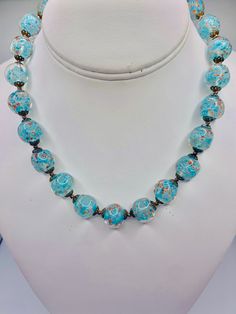 - Vintage blue Murano glass beaded necklace - Beautiful blue glass with with gold accents  - 16 inch necklace  - Gold tone metal shows some slight discoloration due to age  - Overall clean and in good condition  K 2872 Blue Beaded Necklaces With Spacer Beads, Blue Glass Beaded Necklaces With Polished Beads, Single Strand Necklace With Round Glass Beads, Glass Single Strand Necklace With Round Beads, Blue Spacer Beads Jewelry, Blue Costume Jewelry Necklaces With Polished Beads, Single Strand Glass Necklaces With Round Beads, Blue Beaded Round Necklaces, Blue Round Single Strand Beaded Necklace