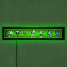 an animated display with five different pop - up figures on it's green background