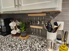 a kitchen counter with pots and pans on it