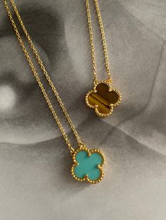 Unlock your irresistibly stylish side with the Clover Necklace! Featuring a beautiful clover design with gold plating, this eye-catching accessory will add an extra touch of glamour and elegance to any outfit. Perfect for special occasions or a night out, you'll never go wrong with this stylish necklace. Trendy Green Flower Shaped Jewelry, Elegant Turquoise Flower Pendant Jewelry, Chic Green Jewelry For Gifts, Elegant Turquoise Jewelry, Tarnish Resistant, Chic Gold Flower Pendant Jewelry, Elegant Turquoise Jewelry With Adjustable Chain, Trendy Gold Flower-shaped Jewelry, Elegant Green Jewelry With Gold Chain, Elegant Turquoise Necklace For Party