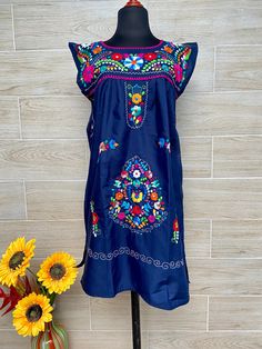 Mexican dress, ethnic dress, embroidered dress, cool dress, multicolored embroidered dress, dress of Oaxaca. Each dress has a unique embroidery. This dress is made with poplin fabric 90% polyester, 10% cotton. Mexican textile art has centuries of history and creativity throughout the country. Mexico is recognized as one of the leading countries with a beautiful aristic production in the textile world, miraculous hands of talented artisans from different states of the country create stunning embr Bohemian Dresses With Embroidered Border For Festivals, Traditional Sleeveless Embroidered Dress, Bohemian Festival Dress With Embroidered Border, Multicolor Embroidered Tunic Dress For Festivals, Traditional Multicolor Sleeveless Embroidered Dress, Traditional Multicolor Embroidered Sleeveless Dress, Folk Tunic Dress With Multicolor Embroidery, Folk Style Festive Dress With Multicolor Embroidery, Multicolor Embroidered Dress For Summer Festivals