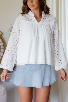 Add a touch of whimsy to your wardrobe with the Mandy Eyelet Blouse. Featuring delicate eyelet detailing, this blouse is sure to make you stand out. (Eyelet on point!) 65% Cotton 35% Polyester Color: White Long Sleeve Blouse All Over Eyelet Detail Light Weight Elastic Wrist Detail Double Lined in all the right placed Relaxed Flowy Style Ruffle Collar Detail Model is wearing a size Small. She is 5'6". 130lbs. Bust: 34" Waist 26" Hips 36" Chic Cotton Blouse With Cutwork Hem, Long Sleeve Blouse For Daywear With Cutwork Hem, Spring Daywear Blouse With Cutwork Hem, Casual V-neck Eyelet Blouse, Feminine Spring Tops With Cutwork Hem, Feminine Spring Top With Cutwork Hem, Cotton Blouse With Cutwork Hem For Daywear, Spring Casual Blouse With Cutwork Hem, Long Sleeve Summer Tops With Cutwork Hem