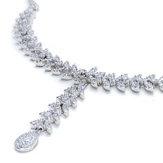 Radiant White Gold Diamond Necklace Set - the perfect addition to any sophisticated ensemble. Crafted from 18k white gold and weighing 24.1 grams, this piece features stunning round diamonds with a total weight of 2.96ct, set in a beautiful 17.5" necklace with a 1.25" drop length. It also comes with matching earrings with a length of 1.25" and screw backs for secure wearing. The lobster lock ensures this set stays safely in place, making it the perfect accessory for any occasion. PRODUCT DETAILS Formal Silver Diamond Chain Necklace, Dazzling Diamond White Platinum Necklace, Dazzling Platinum Necklace In Diamond White, Dazzling White Platinum Necklace, Silver Platinum Bridal Necklace With Single Cut Diamonds, Silver Bridal Necklace With Single Cut Diamonds In Platinum, Elegant Silver Tennis Necklace With Single Cut Diamonds, Silver Platinum Bridal Necklace With Diamond Cut, Dazzling Silver Brilliant Cut Diamond Necklace